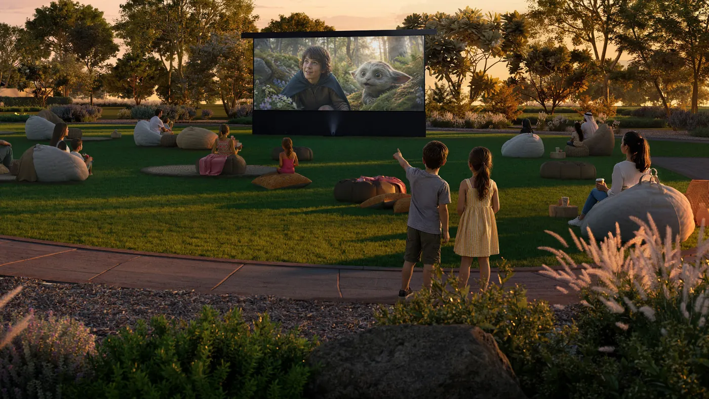 Families on bean bags watching an open-air movie on the events lawn